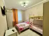 Четырёхместный номер Комфорт, двуспальная и двухъярусная кровати