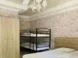 Семейный номер четырёхместный с двуспальной и двухъярусной кроватями