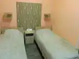 Двухместный номер с 2 отдельными кроватями с общим санузлом и кухней