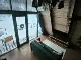 Двухэтажный а-фрейм с панорамным остеклением и террасой