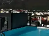 Апартаменты с бассейном на крыше с видом на горы