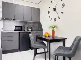 Модульный дом для четверых Часы