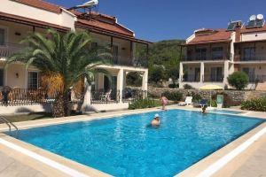 Stunning Spacious Poolside 2-Bed Apt in Ovacik, Фетхие