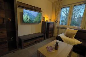 Modern apartment with forest flair and coffee enjoyment, Падерборн