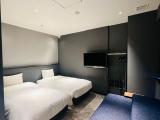 Corner Twin Room With Sofa Bed