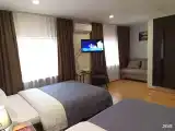 Улучшенный двухместный номер с двумя двуспальными кроватями