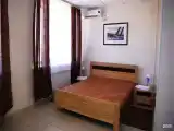 Двухместный номер с двуспальной кроватью и дополнительной кроватью
