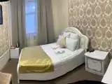 кровать в 8-ми местном женском номере с санузлом