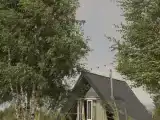 Треугольный домик с гамаком и камином