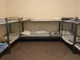 Кровать в 8-местном общем мужском номере