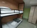 8 местный мужской номер с капсульными кроватями