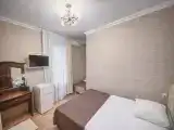 Бюджетный двухкомнатный семейный пятиместный номер