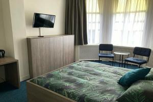 Hotel Poseidon, Схевенинген