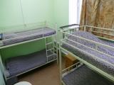 Спальное место на двухъярусной кровати в общем номере для мужчин