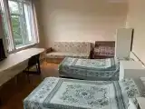 Кровать в общем 4-местном номере для мужчин и женщин