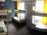 Спальное место на двухъярусной кровати в общем номере для мужчин