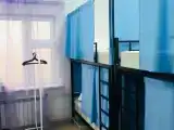 Спальное место на двухъярусной кровати в общем номере для мужчин и женщин