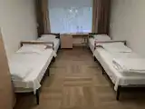 Четырехместный номер эконом-класса с общей ванной комнатой