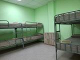 Спальное место на двухъярусной кровати в общем номере для мужчин