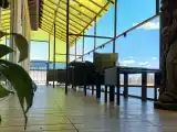 Двухместный номер на Террасе с видом на ОЗЕРО Селигер, с одной двуспальной кроватью и раскладным креслом для ребенка.