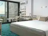 Люкс двухкомнатный с двуспальной кроватью и двумя раскладными креслами/односпальными кроватями/корп.Yalta Int.Green Park
