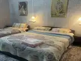 Трехместный номер с собственной ванной комнатой