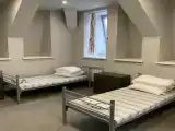 Односпальная кровать в общем 7 местном номере