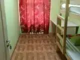 Спальное место на двухъярусной кровати в общем номере для мужчин