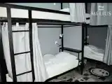 Спальное место на двухъярусной кровати в общем номере для мужчин